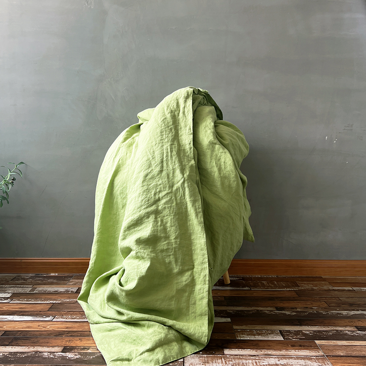 Green Tea Linen Duvet Cover On un-folded on Chair - linenshed AU